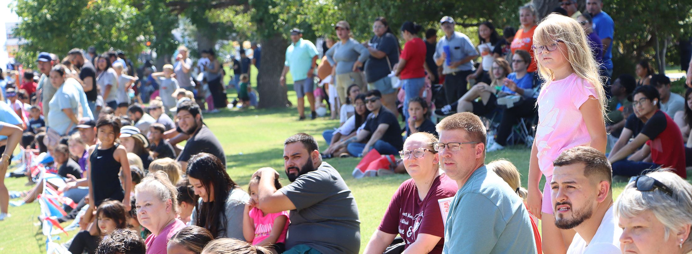 Residents watching a community event