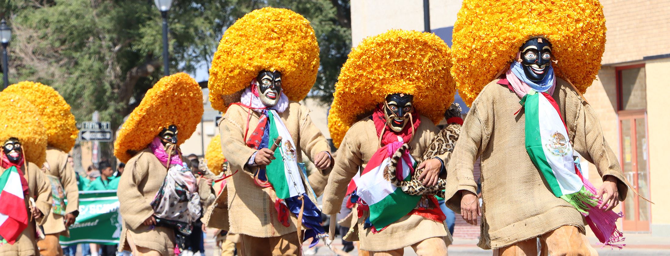 People wearing Hispanic/Latino apparel in a parade