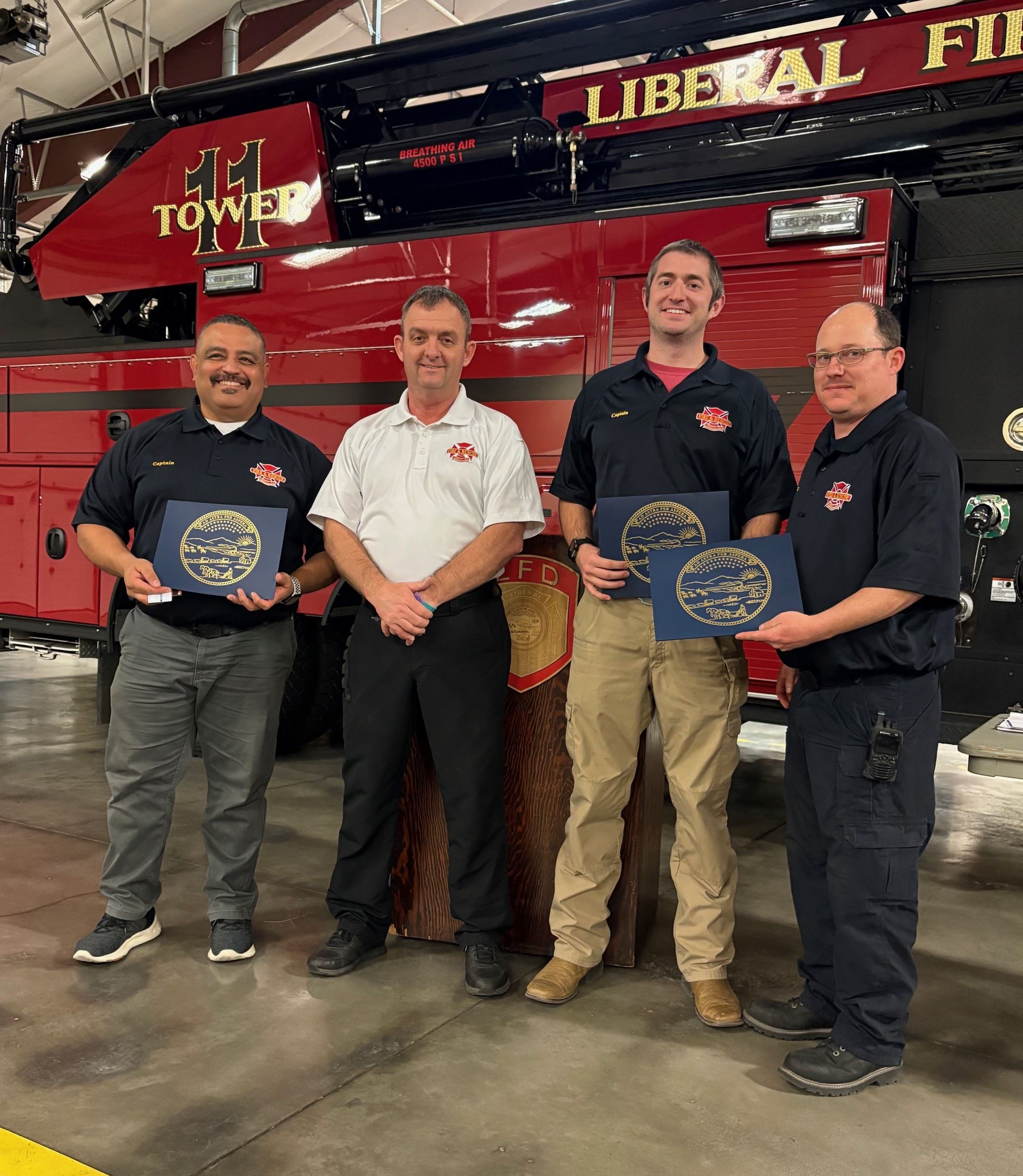 D. Loesch, A. Luman, and J. Torres receive their Fire Service Leadership Apprentice recognition
