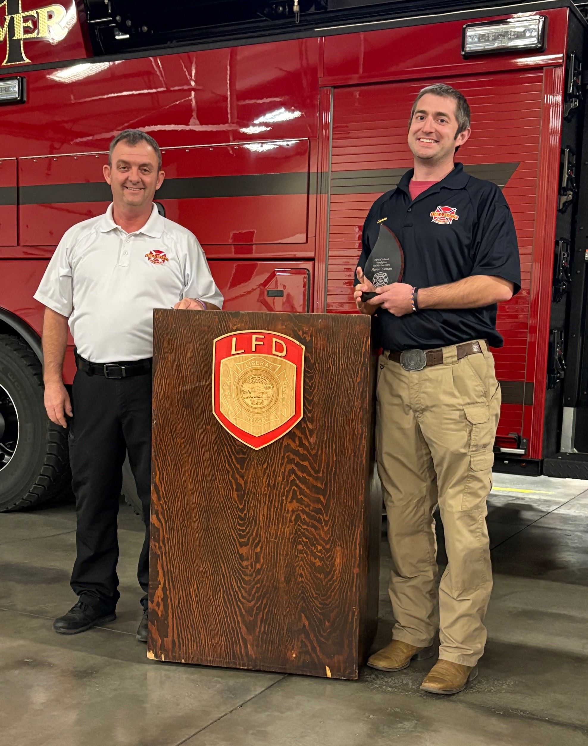 Aaron Luman receives his Firefighter of the Year award
